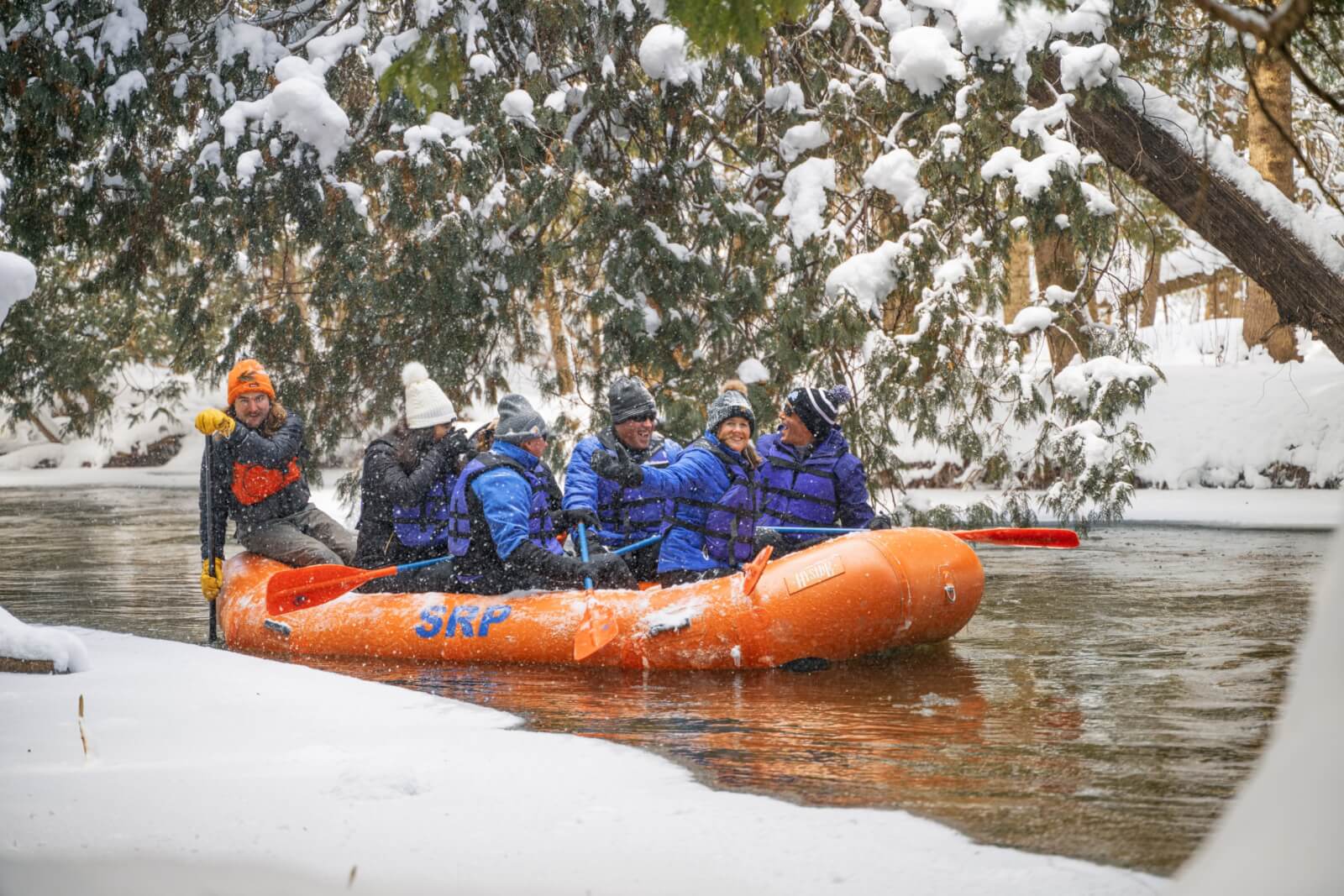 People rafting in the winter