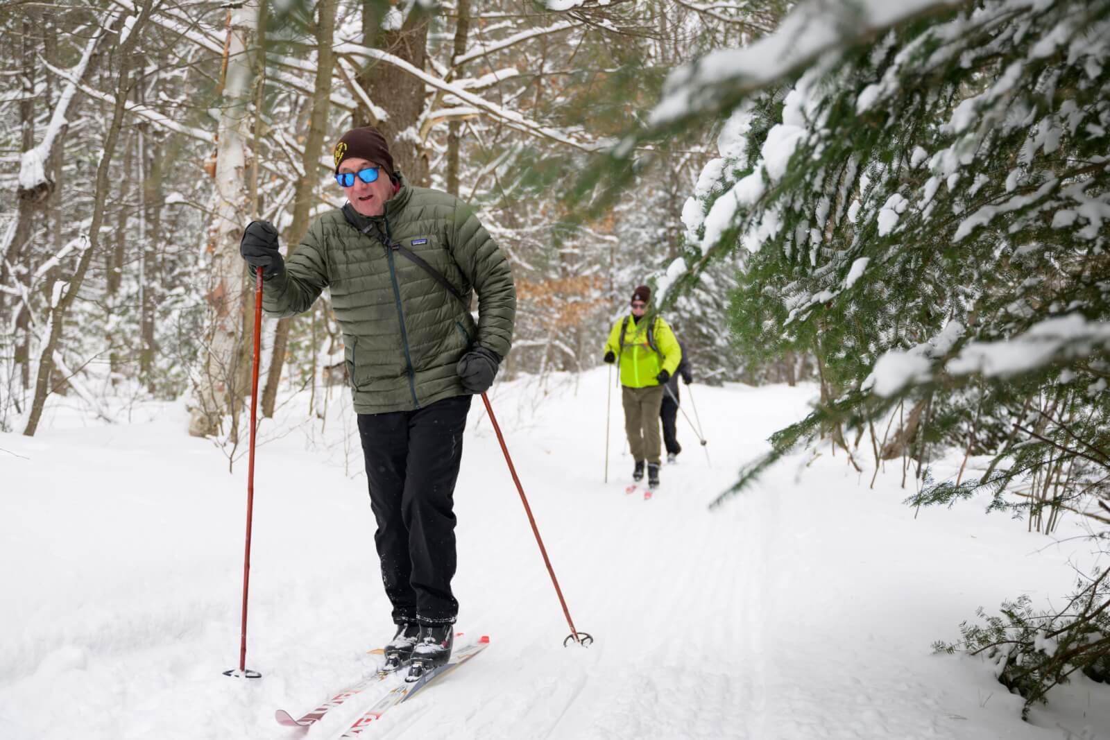 Man cross-country skiing in the woods